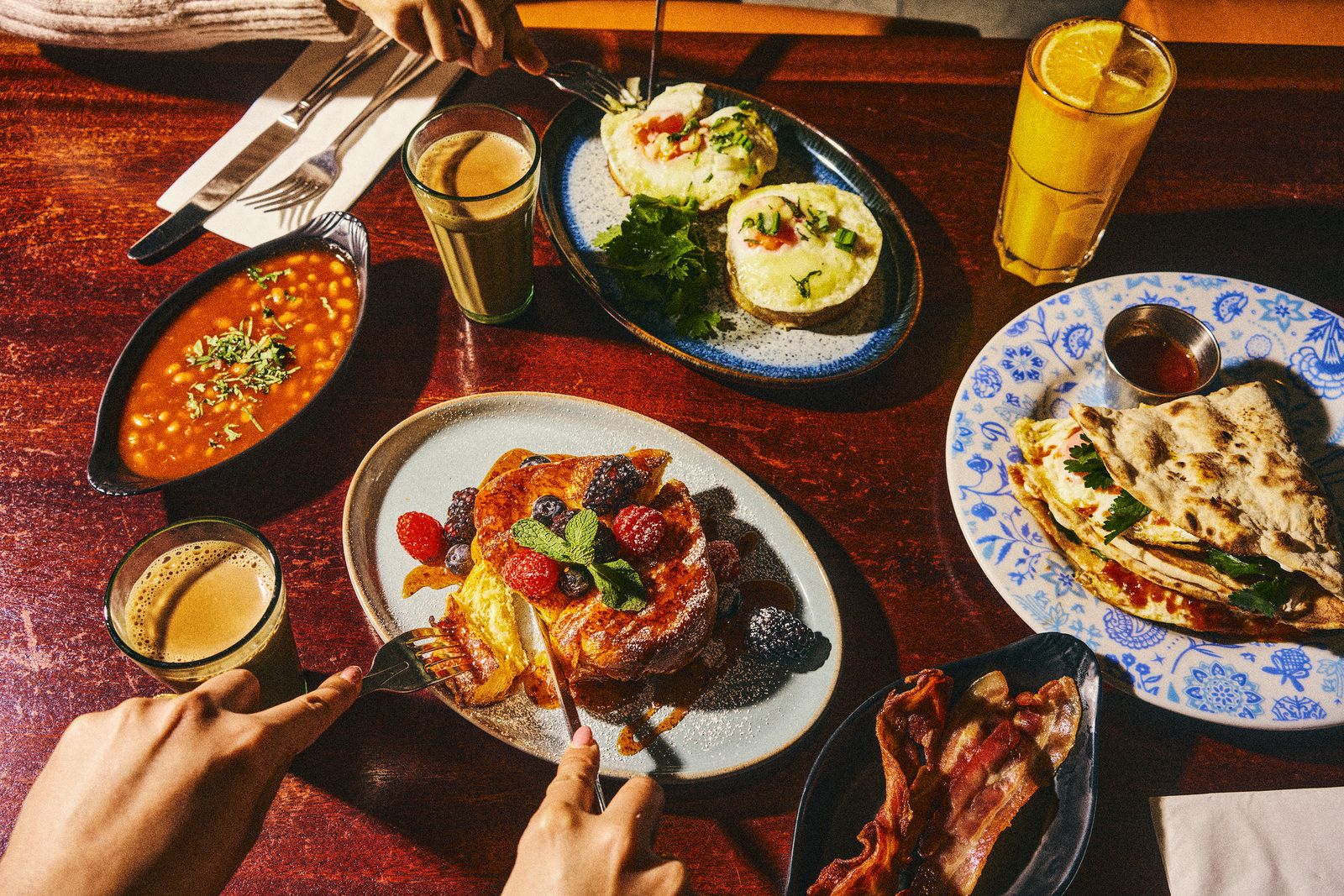 Image may contain Brunch Food Cup Blade Knife Weapon Food Presentation Plate Cutlery Fork Adult and Person