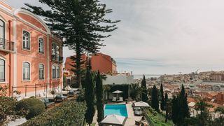 Image may contain Architecture Building House Housing Villa Pool Water Swimming Pool Bench Furniture and Outdoors